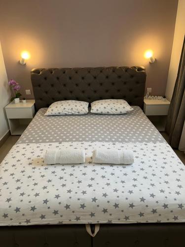 a bed with two pillows on top of it at Apartman Mijailović 3 in Soko Banja