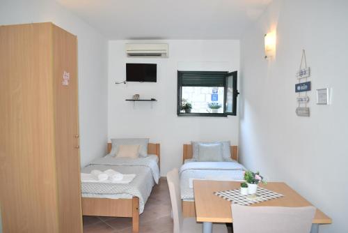 Postel nebo postele na pokoji v ubytování Twin Love Apartment