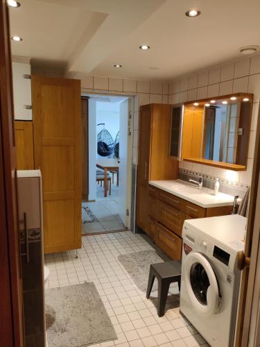 a kitchen with a washer and a washing machine at Sun in Närpiö