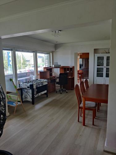 an empty living room with a table and chairs at Sun in Närpiö