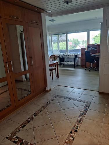 a living room with a door and a table at Sun in Närpiö
