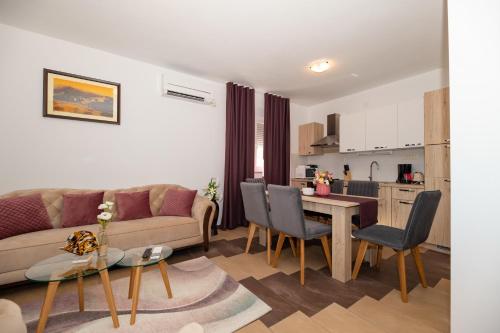 a living room with a couch and a table at Lucija in Starigrad-Paklenica