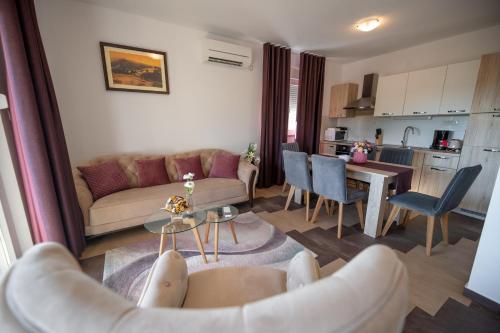 a living room with a couch and a table at Lucija in Starigrad-Paklenica