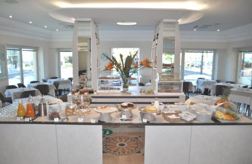 a kitchen filled with lots of white appliances at Hotel Boncardo in Finale Ligure