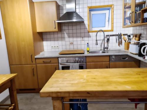 a kitchen with a sink and a stove top oven at Ferienwohnung Till in Mölln