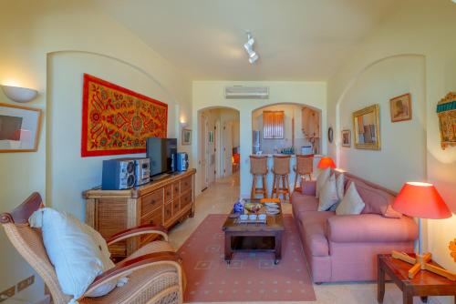 a living room with a couch and a table at VESTA - El Gouna Residence in Hurghada