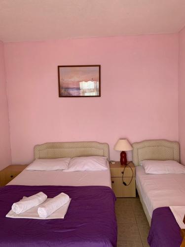 Ένα ή περισσότερα κρεβάτια σε δωμάτιο στο Arabela Apartments