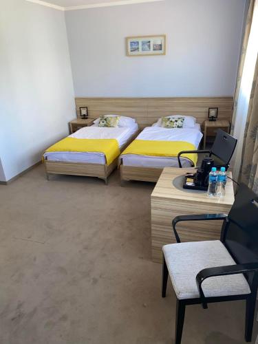 Una cama o camas en una habitación de Hotel Alpex