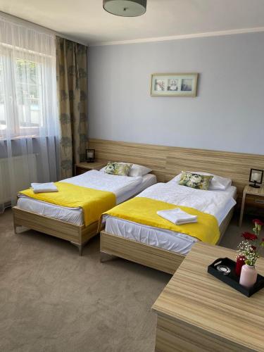 Una cama o camas en una habitación de Hotel Alpex
