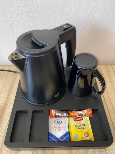 Tetera y cafetera en Hotel Alpex
