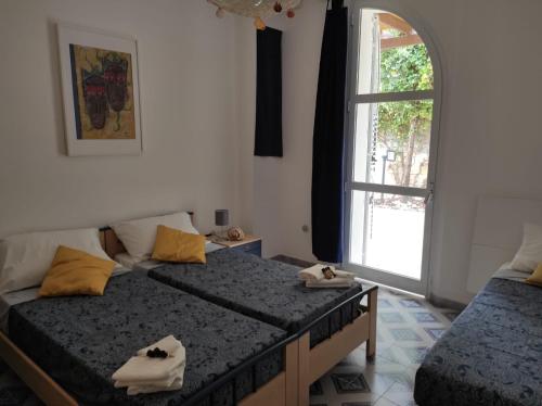 Llit o llits en una habitació de Villetta Gallipoli Baia Verde Tigli 33