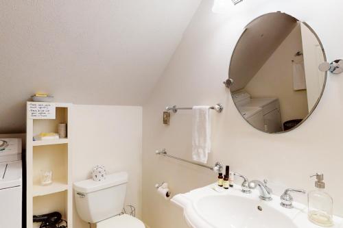 a bathroom with a sink and a mirror at Harborside Retreat in Falmouth