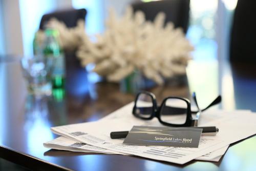 a pair of glasses sitting on top of a table at Springfield Lakes Boutique Hotel in Springfield Lakes