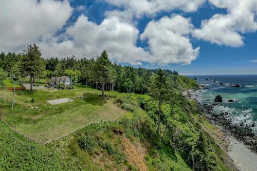 an aerial view of a house next to the ocean at Trinidad Pearl in Trinidad