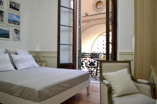 A bed or beds in a room at Pontevecchio Relais