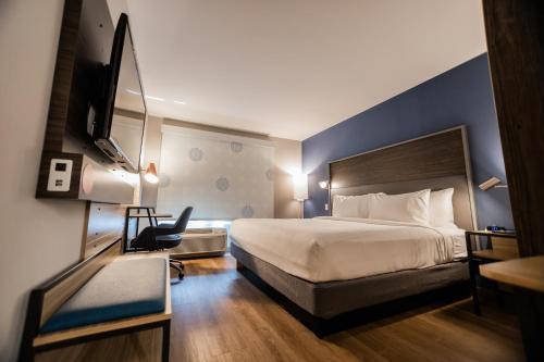 a hotel room with a bed and a tv at Tru By Hilton Yarmouth, Ns in Yarmouth