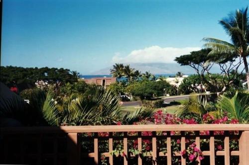 a view from the balcony of a resort at Beautiful 2 Bedroom Oceanview Condo at Maui Kamaole Located at South End of Kihei Adjacent to Wailea Traditional Hawaiian Style in Wailea