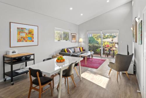 a living room with a white table and chairs at VILLA 17 CAPE VILLAS in Dunsborough