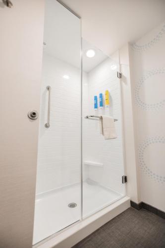a shower with a glass door in a bathroom at Tru By Hilton Yarmouth, Ns in Yarmouth