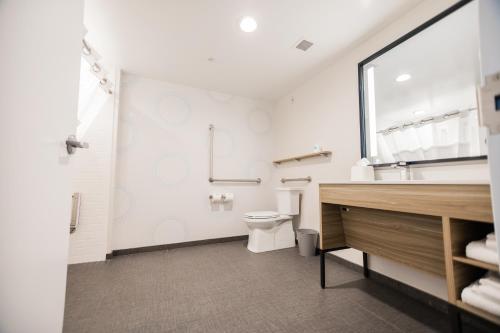a bathroom with a toilet and a sink at Tru By Hilton Yarmouth, Ns in Yarmouth