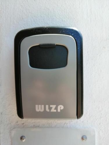 a close up of a cell phone on a wall at Casetta la Terrazza in Civita Castellana