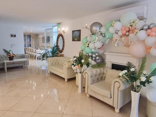 a living room with balloons and a fireplace at Hotel Dalia - Bankya in Bankya