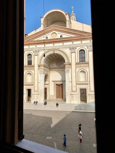 a large building with people standing in front of it at CasaLonghi in Mantova