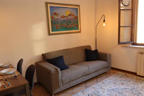 a living room with a couch and a table at CasaLonghi in Mantova