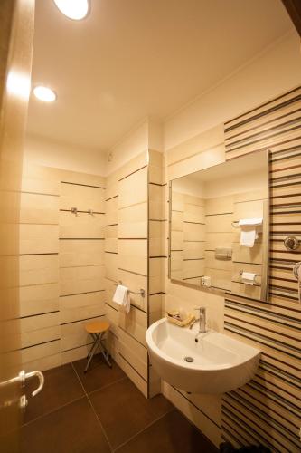 a bathroom with a sink and a mirror at Hotel Villa San Pietro in San Giovanni Rotondo