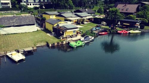 an aerial view of a house with boats in the water at Ferienwohnungen Schiller in Landskron