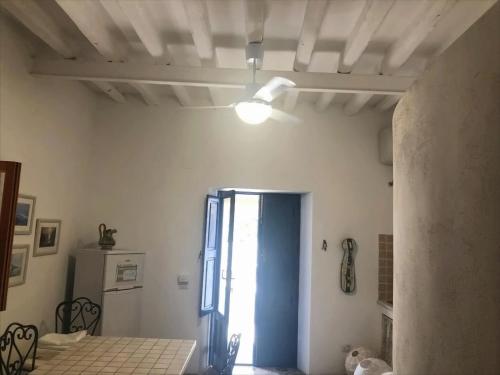 a room with a room with a door and a window at Casa Galletta in Stromboli