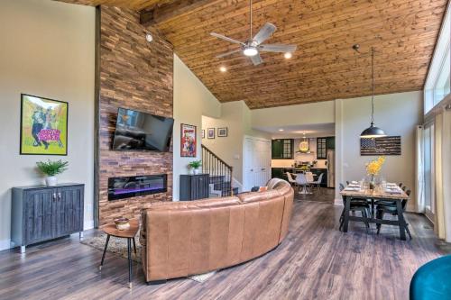 a living room with a couch and a fireplace at Breathtaking Views Unique Chimney Rock Cottage! in Lake Lure