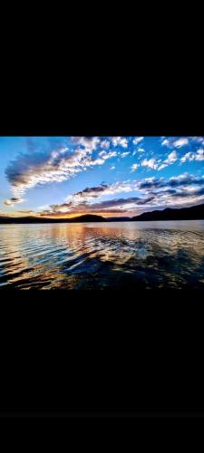 a view of a body of water with clouds in the sky at Casa Laura in Orşova