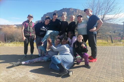 a group of people posing for a picture at Maluti Backpackers in Phuthaditjhaba