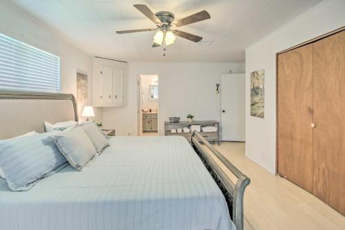 a bedroom with a bed with a ceiling fan at Waterfront Onalaska Retreat with Private Dock! in Blanchard