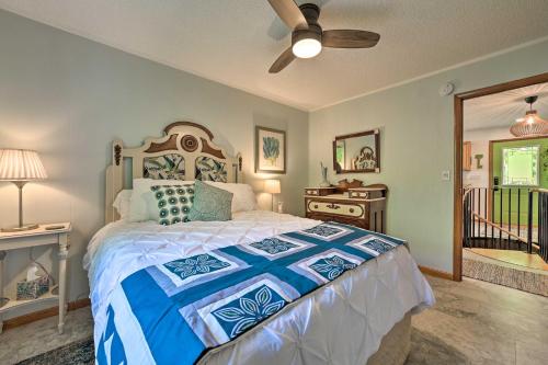a bedroom with a bed and a ceiling fan at Northern Nights Beachfront Cottage in Kalkaska in Kalkaska