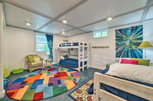 a bedroom with a bunk bed and a colorful rug at Northern Nights Beachfront Cottage in Kalkaska in Kalkaska