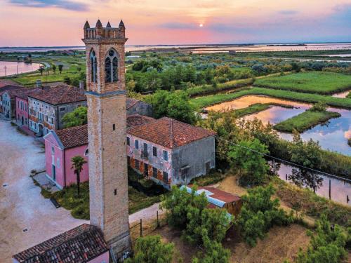 an aerial view of a building with a clock tower at appartamento ai do mori in Cavallino-Treporti