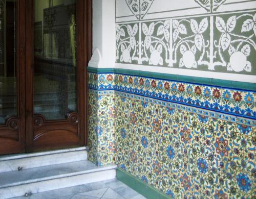 a tiled side of a building with a window at Casa del Mediterraneo in Barcelona