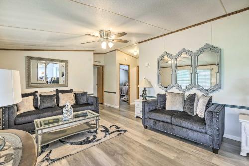 a living room with two couches and a mirror at Charming Countryside Home with Covered Porch! in Livingston