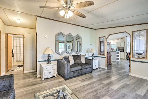 a living room with a couch and a ceiling fan at Charming Countryside Home with Covered Porch! in Livingston