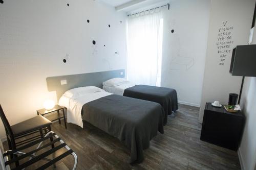 Una cama o camas en una habitación de Boutique Hotel Novecento