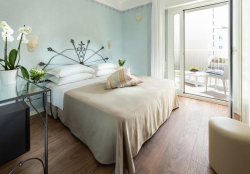 Posteľ alebo postele v izbe v ubytovaní Hotel Apollo