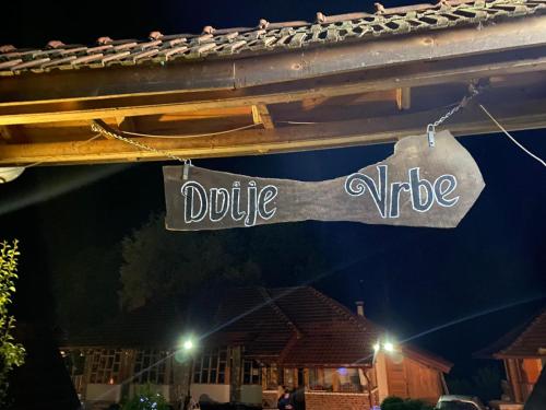a sign that reads doubleride hanging from a building at Rafting Kamp Dvije Vrbe in Foča