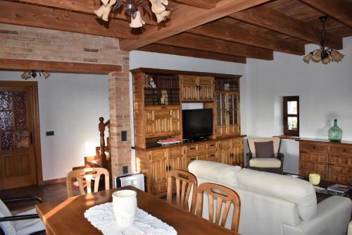 a living room with a table and a couch at Casa Carmen y Mera in Ferroñes