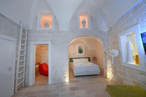 A bed or beds in a room at Pietra Bianca Luxury Suite Ostuni