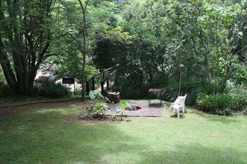 a garden with a playground and a swing set at Sabie Star in Sabie