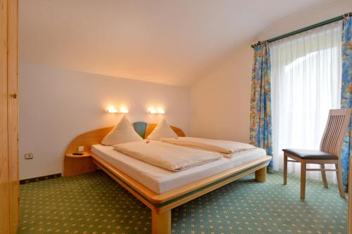 Krevet ili kreveti u jedinici u okviru objekta Gästehaus Alpengruss