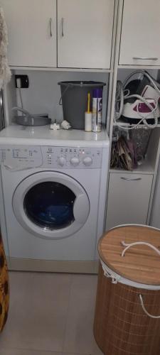 a washer and dryer in a kitchen with a counter at Villa Lara in Marsaglia
