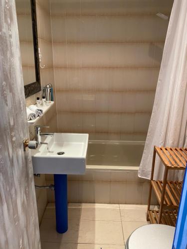 a bathroom with a sink and a bath tub at El Chili Boutique Hotel in Barbate